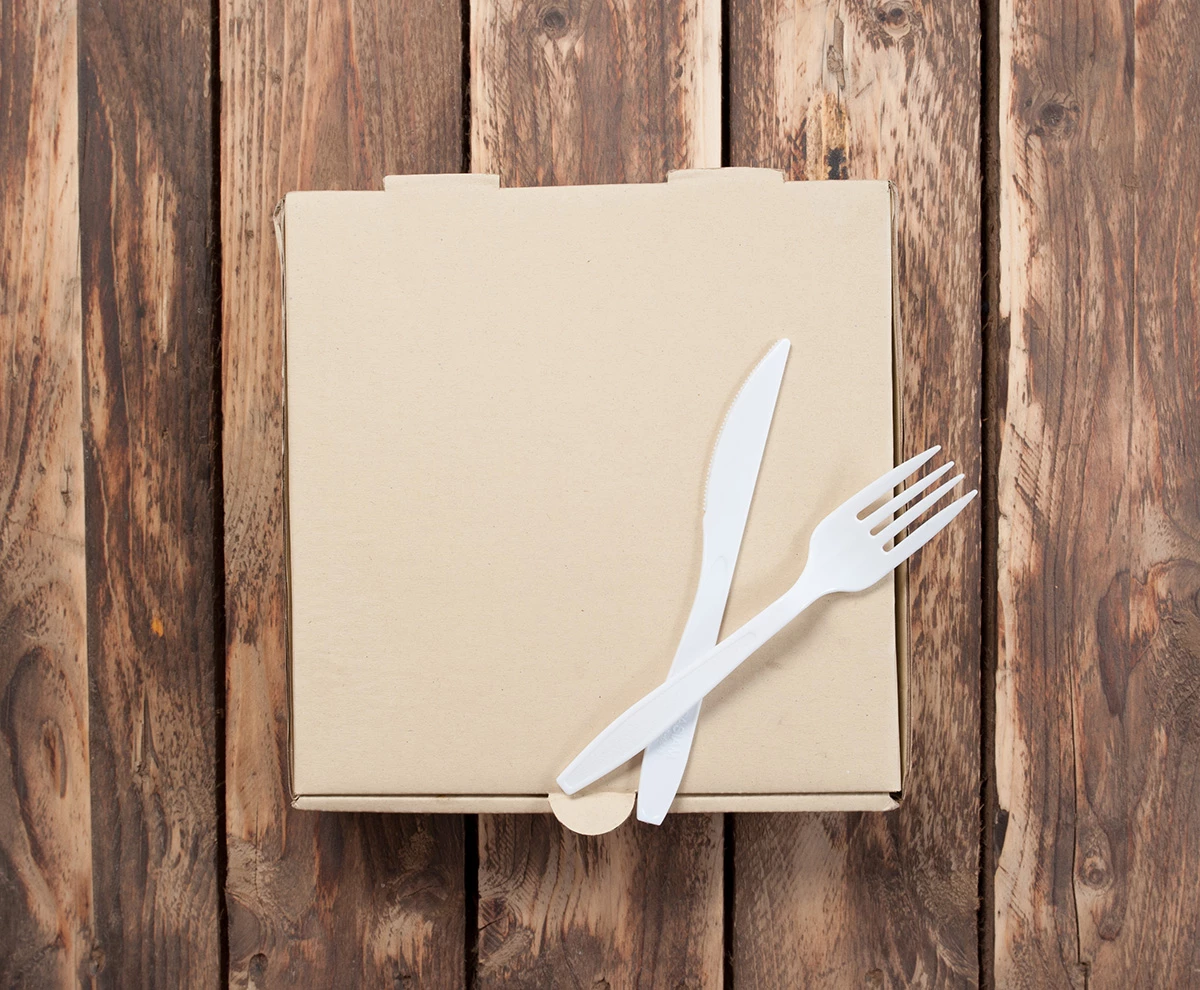 Plastic Utensils on Cardboard Box