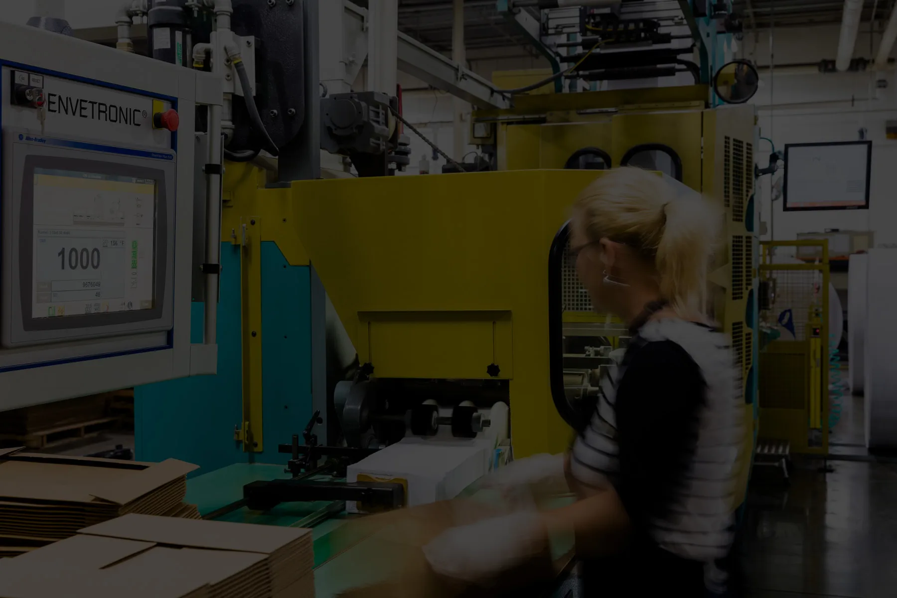 Employee working a printing press