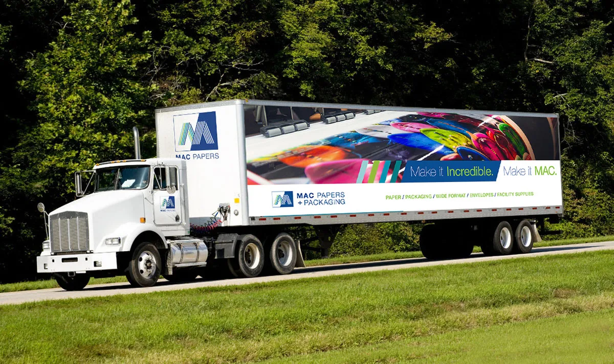 MAC Papers Semi Truck driving down the road