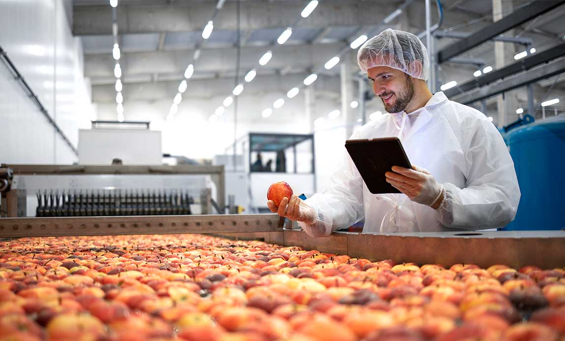 worker-inspecting-fruit