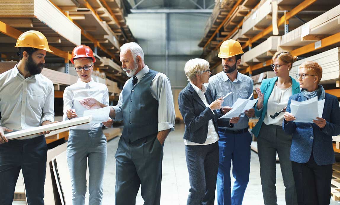 workers-in-factory-discussing-project